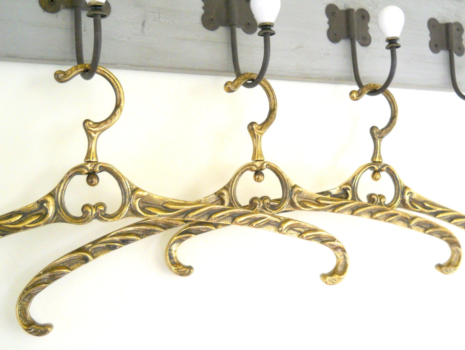 RESERVED for THESPECLEDFEATHER 5 vintage brass coat hangers