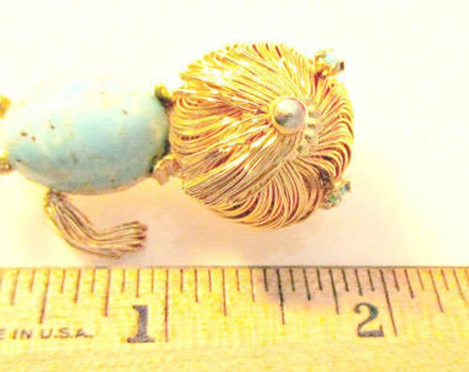 Dog brooch of gold wire wrapped and blue speckled cabochon figurine pin