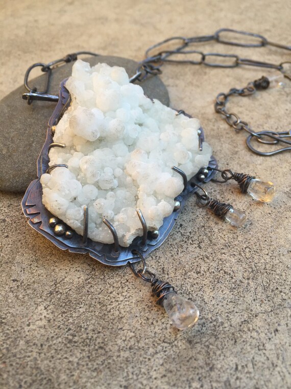 Items similar to mythical statement necklace with gyrolite and raven