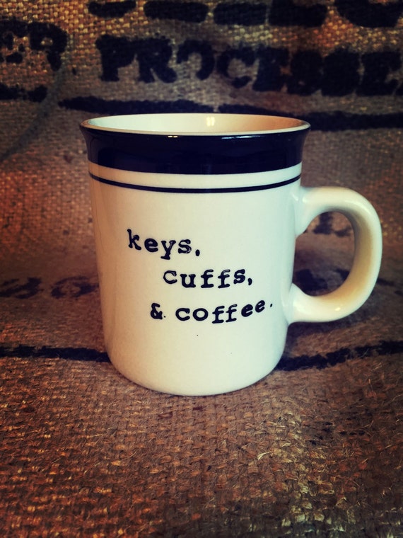 Keys cuffs and coffee COFFEE CUP