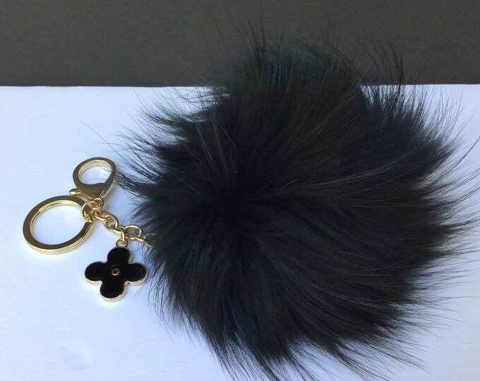 Fur pom pom keychain, bag pendant with flower charm in black