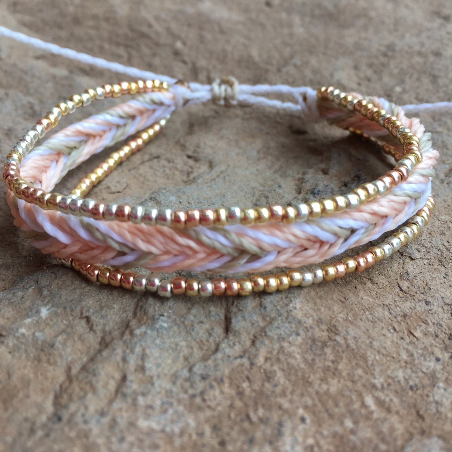 1 string braided bracelet with two strands of permanent finish