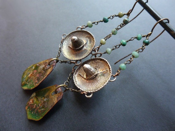 Anemia. Green assemblage earrings with sterling silver sombrero charms. 