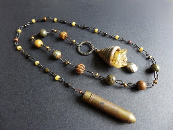 Untold Story. Baltic amber and rustic bell lariat.