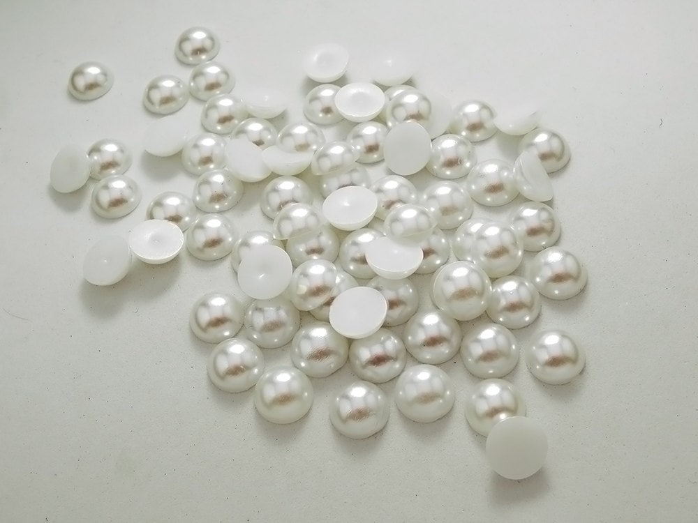 white flats with pearls