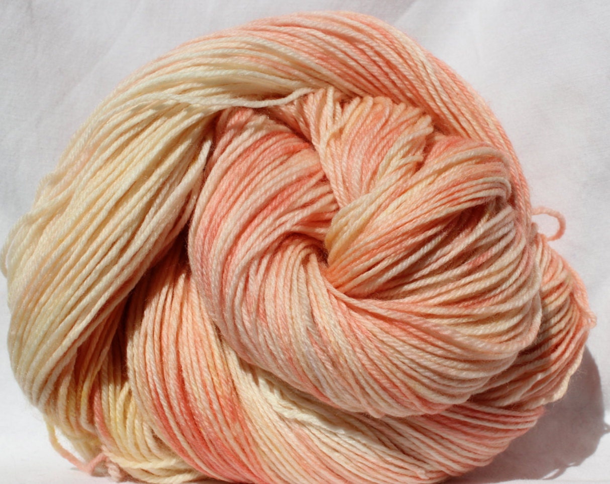 Hand dyed yarn peach / cream yarn variegated by SMAKSuperFibers