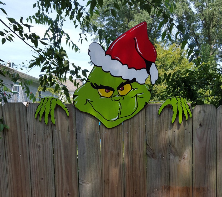 The Grinch is coming over the Christmas Fence Climber