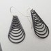 black cyclone earrings