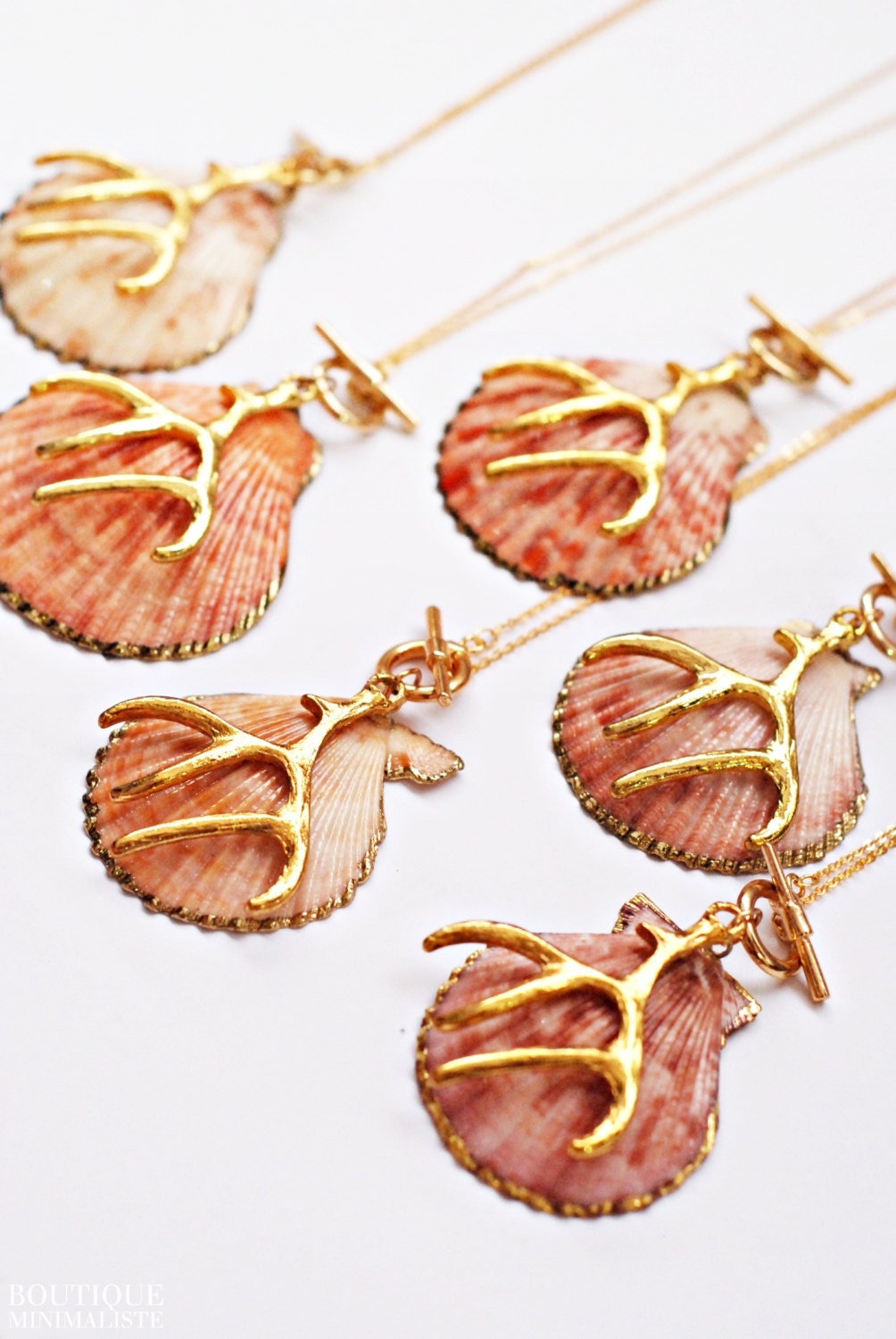 Seashell Necklace dipped in gold with a coral charm