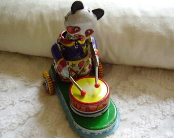 Vintage Metal Collector's Push Toy
