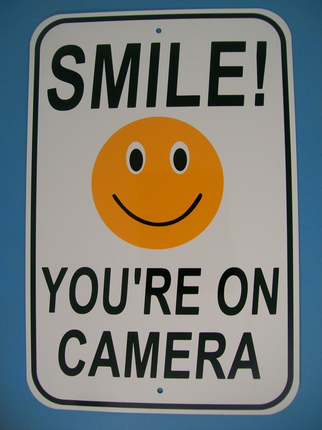 smile-you-re-on-camera-12x18-aluminum-security-sign-cctv