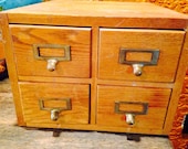 Vintage four drawer library card catalog cabinet. Awesome piece of vintage home decor.