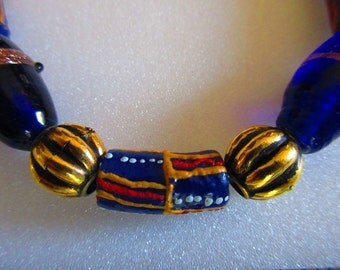 African Krobo and cobalt blue Czech glass beaded bracelet, ethnic, trade, hippie, boho, red, yellow, blue
