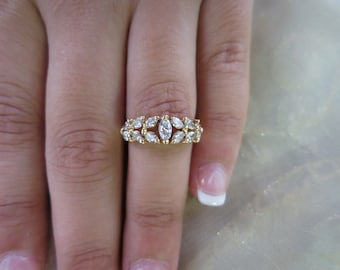 14k Yellow gold marquise diamond ring.