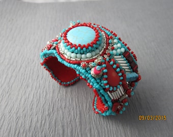 Bead embroidered cuff, turquoise, red and silver