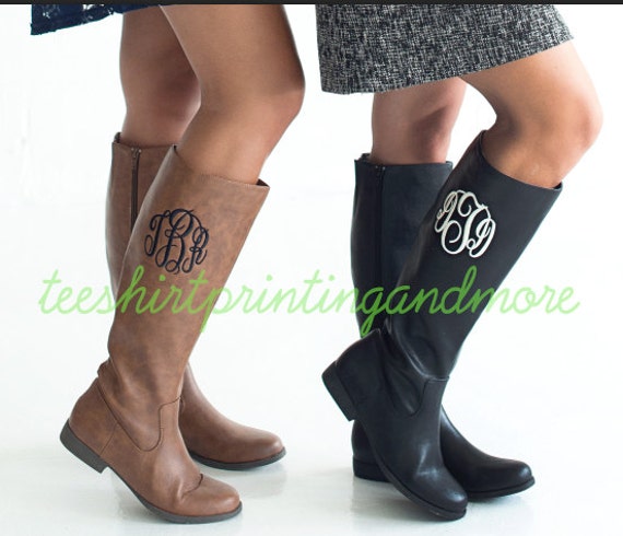 monogram plaque long leather boots