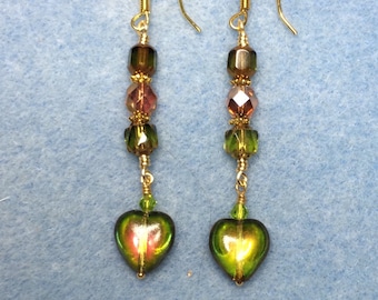 Olive green and burnt orange Czech glass heart dangle earrings adorned with olive green and orange Czech glass beads.