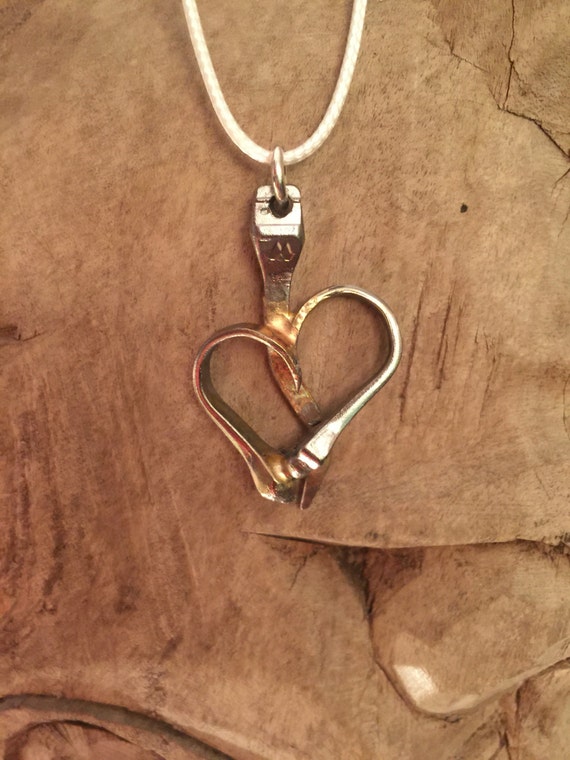 Heart hanging from a string by Kellectablesllc on Etsy