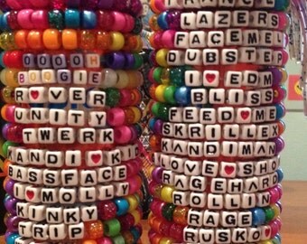 1-100 lot sizes of Handmade Custom Kandi Bracelets. Multiple lot sizes available. Choose any phrase and pattern. Rave concert festival edc!