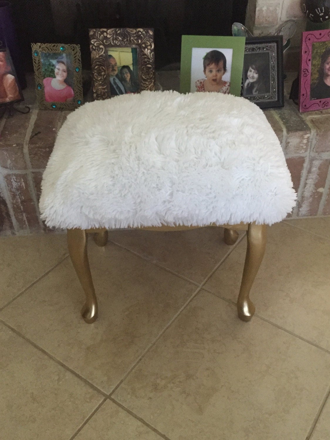 Vanity stool with gold legs and white faux fur