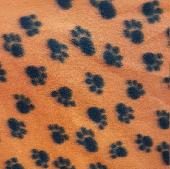 Orange Paw Print Fleece Fabric by the yard