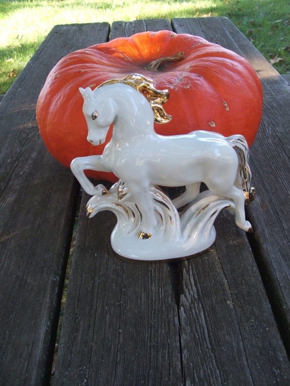 white ceramic horse statue