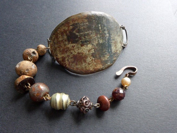 Monachopsis. Brown rustic assemblage bracelet with salvaged tin.