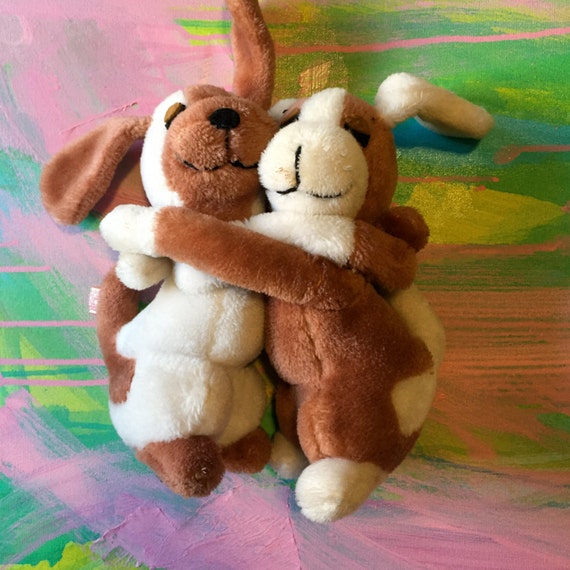 stuffed animals hugging each other