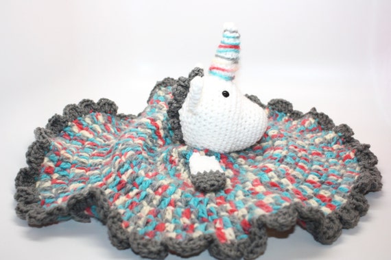 unicorn stuffed animal with blanket