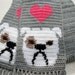 English Bulldog Scarf. Grey, crochet scarf with white bulldogs and bright pink hearts.
