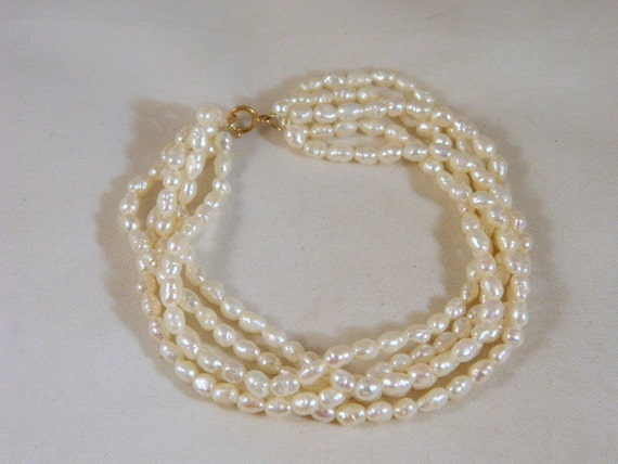 Genuine Multi Strand Pearl Bracelet / by VintageBaublesnBits
