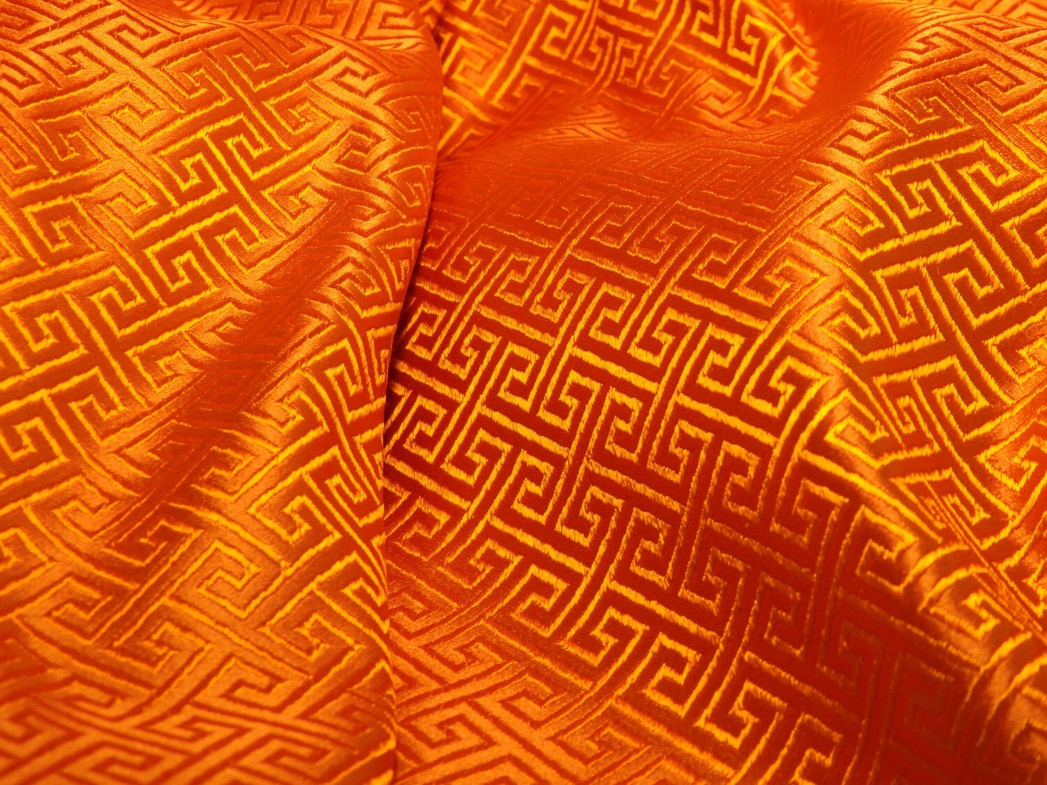 Chinese SILK brocade fabric in vibrant orange with a