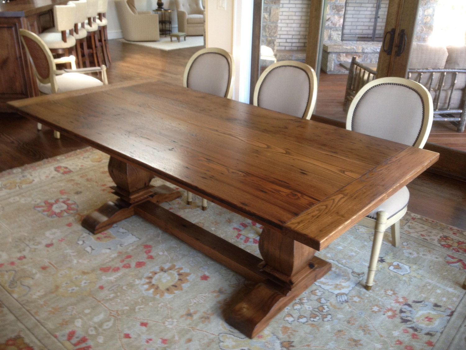 Trestle dining table in reclaimed chestnut.