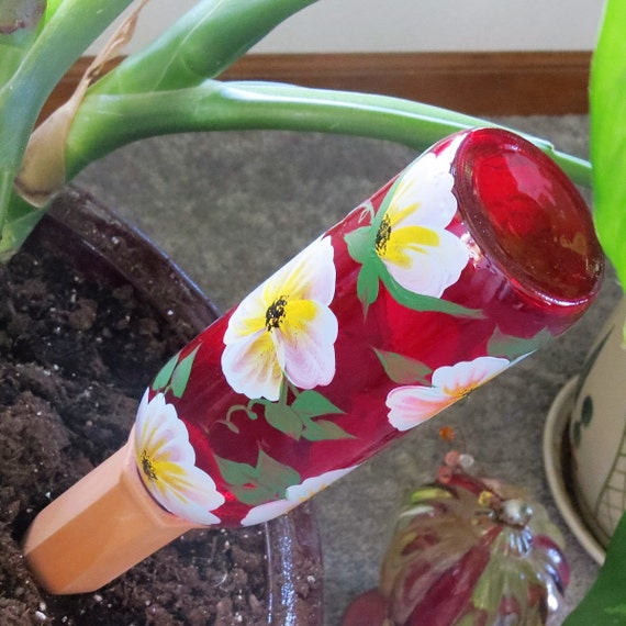 Gravity feed watering system recycled wine bottle watering