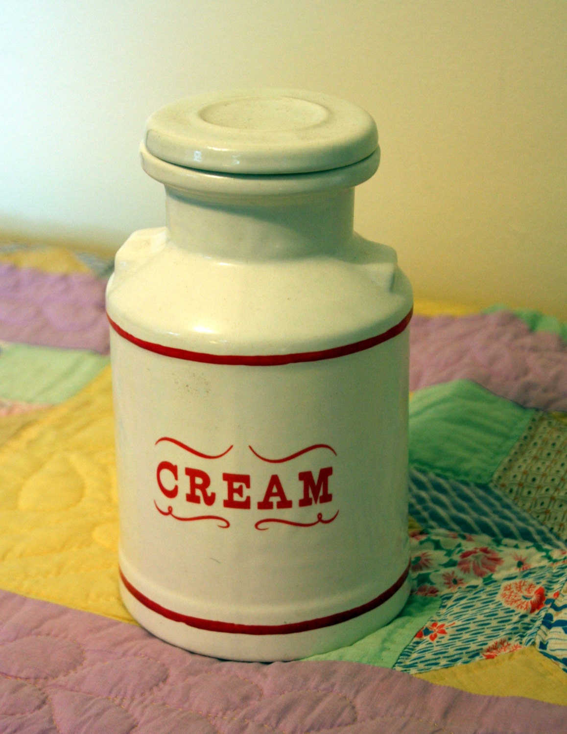 White cream jar with redceramic jar with lid