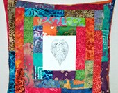 Quilted pillow cover with hand printed leaves surrounded by batiks for 16 inch pillow #147