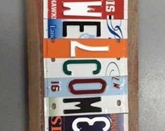 Custom made license plate signs that benefit people with disabilities
