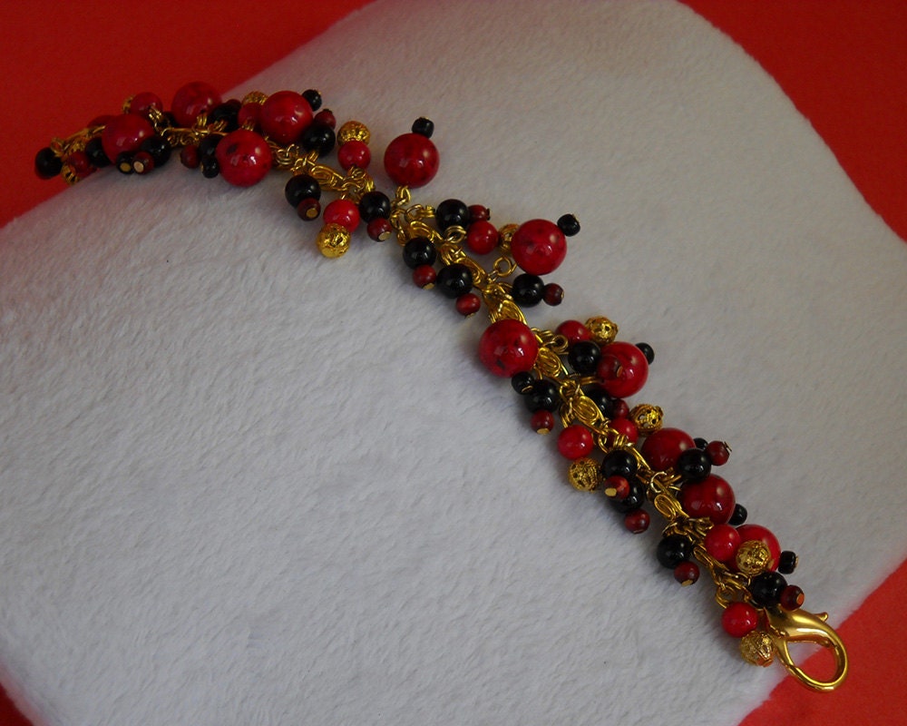Red black and gold beaded charm bracelet Charm bracelet Red