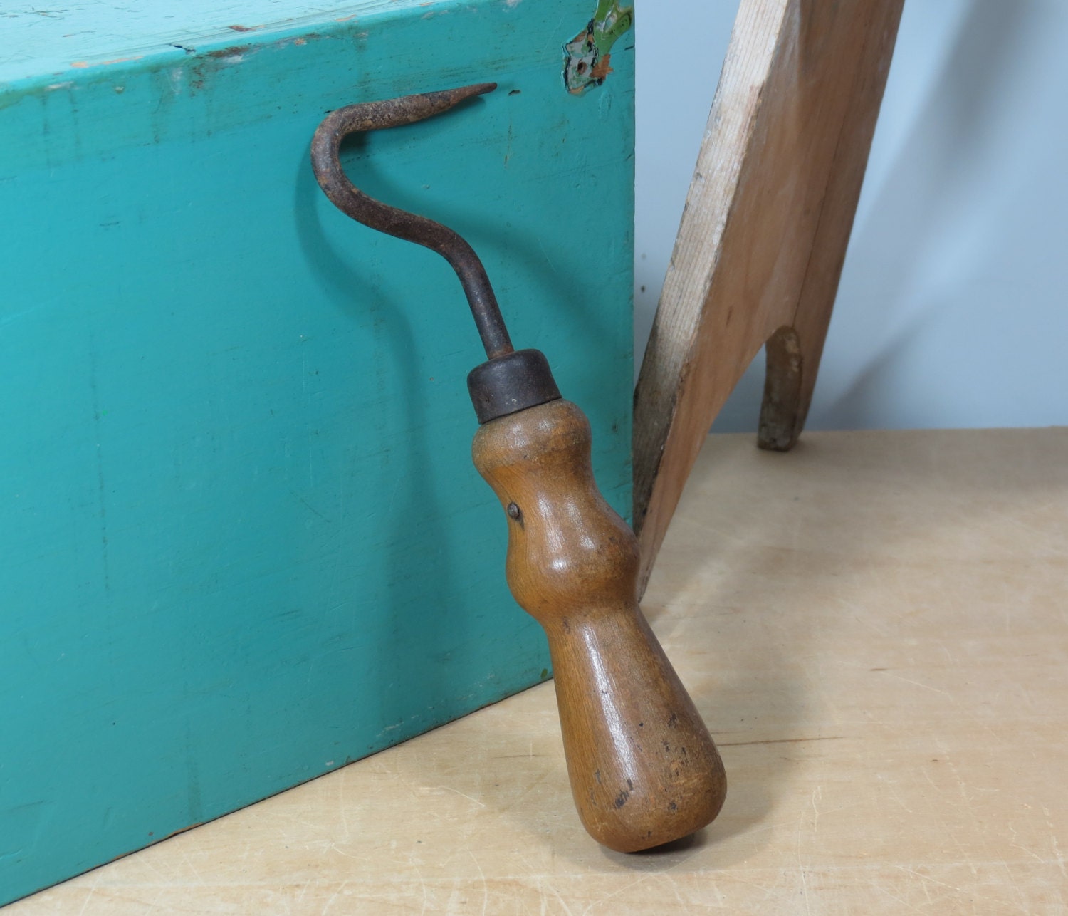 Short wooden handle and flat metal hook with a dimple : r