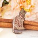 Cat brooch with Indian floral pattern