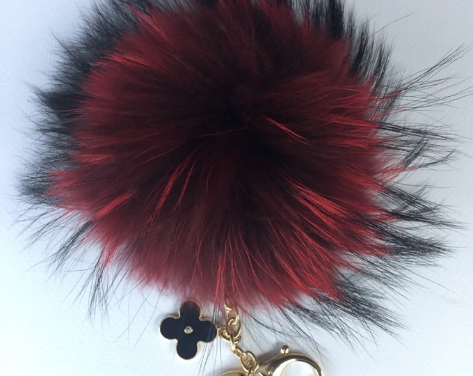 Deep red with natural markings Raccoon Fur Pom Pom luxury bag pendant + black flower clover charm keychain