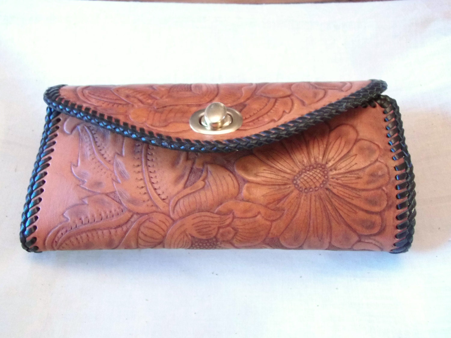 Hand tooled leather clutch purse in a flower design Made in
