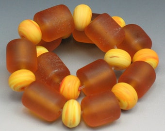 22 Handmade lampwork glass donut and barrel beads by SJC Lampwork