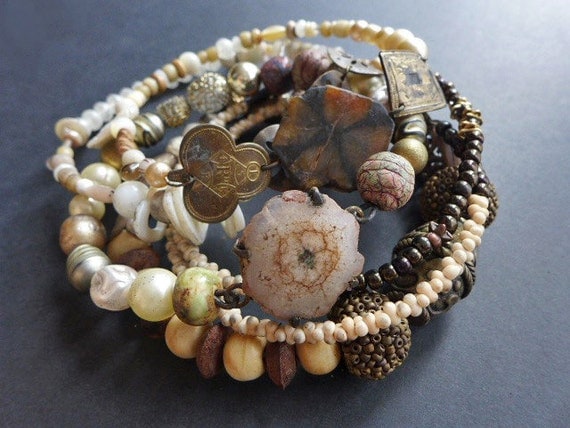 Oblivion Ends the Coil. Assemblage bangle stack, bracelet set in earthy neutrals.