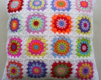 a hippie happy crochet granny square cushion cover / pillow cover in white edging