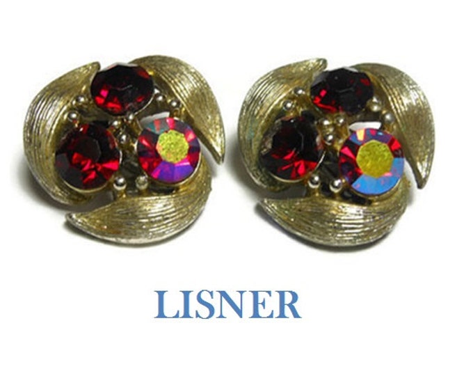 FREE SHIPPING Lisner red clip earrings, two ruby red faceted rhinestones, one Aurora Borealis (AB), light gold tone ribbed leaves