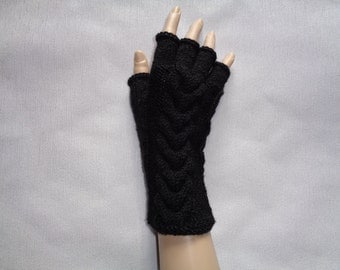 Handknitted black color women fingerless gloves / wrist warmers with cables