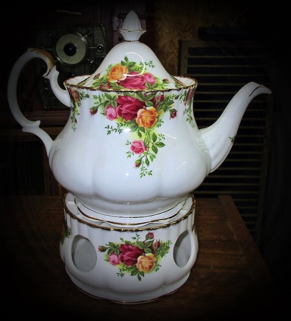 Royal Albert Old Country Roses teapot and teapot warmer.