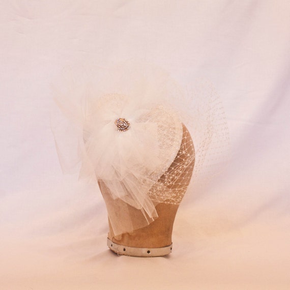 Striking white/ivory heart shaped hat with jewel detailing