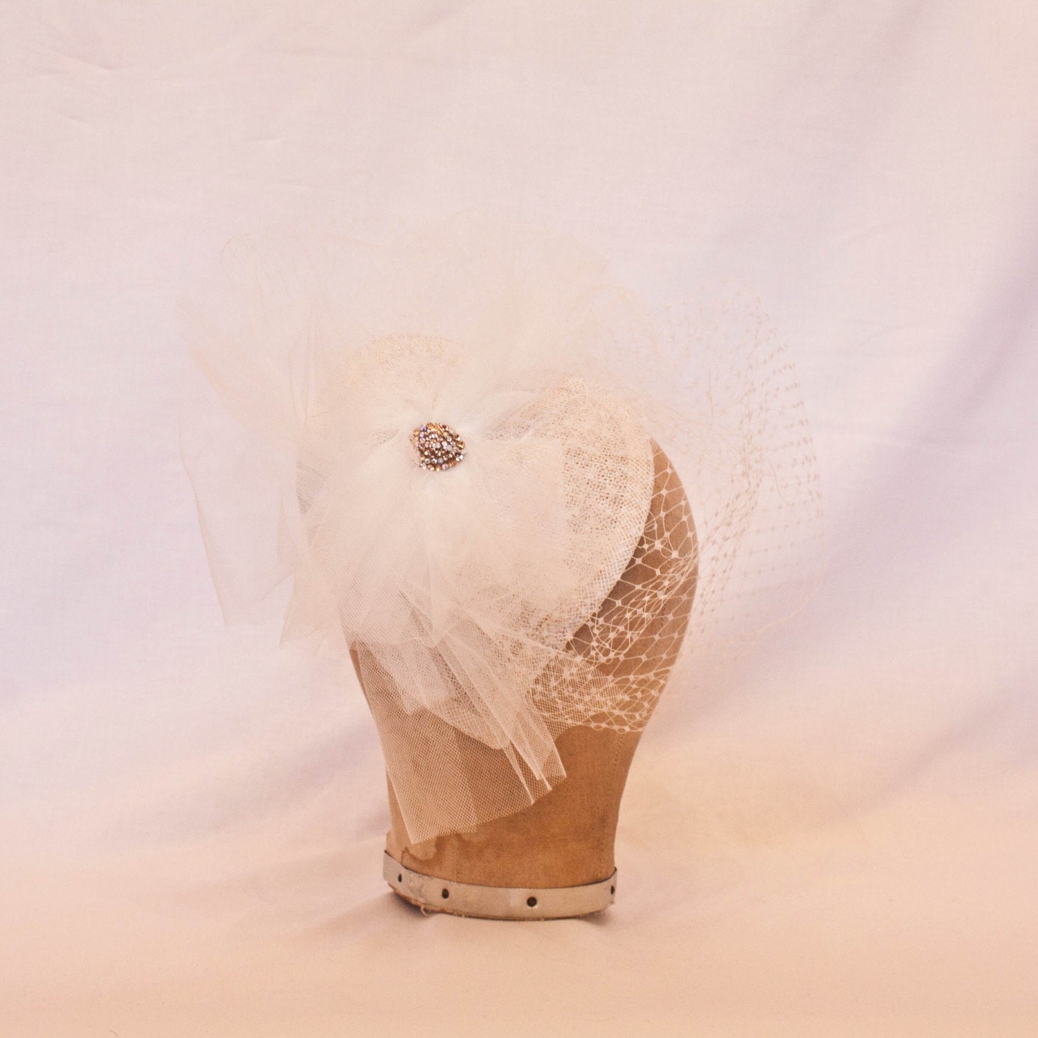 Striking white/ivory heart shaped hat with jewel detailing